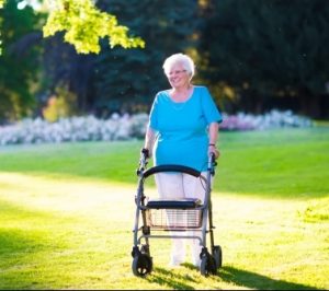 Elderly-lady-with-walker-in-sunny-garden